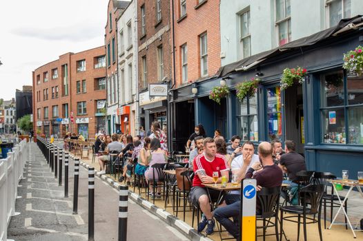 capel street pub with people sitting outside