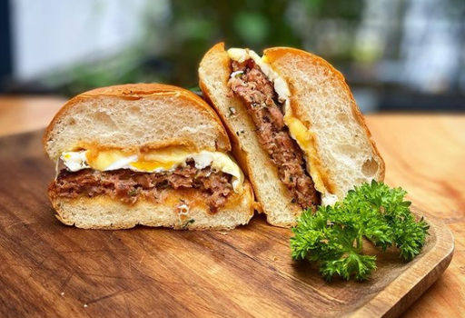 sandwich cut in half on a chopping board