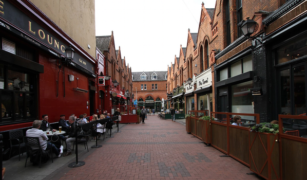 castle market in dublin, with red brick pavement and pubs and restaurants on either side