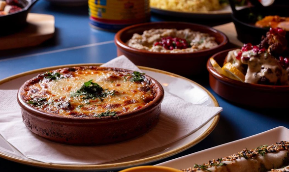 set table with mezze plates to share