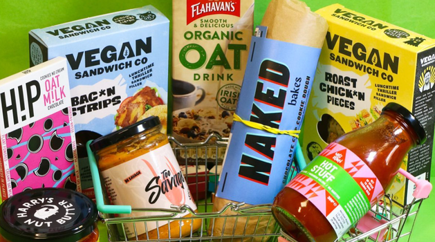 a selection of vegan and plant based products against a green background