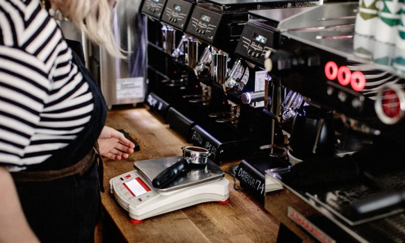 coffee grounds being weighed by a barista in a dublin cafe