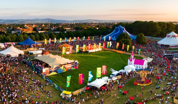 aerial shot of Forbidden Fruit Festival with tents, flags, and people throughout the campsite