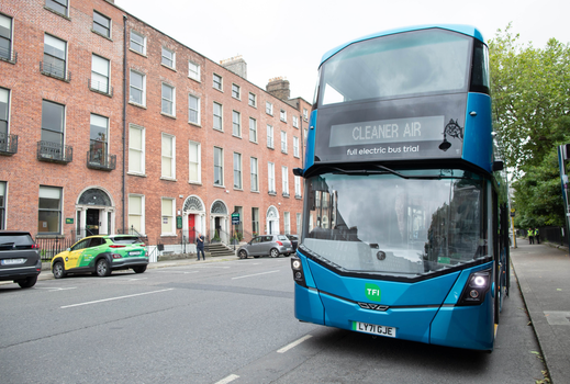 blue bus with a sign that reads "Cleaner Air" on a Dublin Street