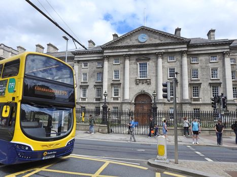 exterior shot of college green in dublin with bus driving past