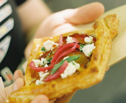 pastry with crumbled feta and pickled onions