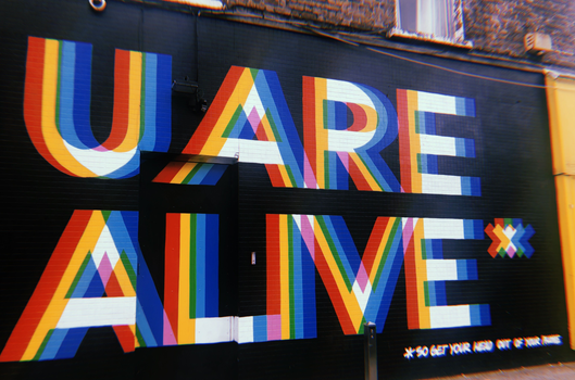 "U Are Alive" black and white mural in Dublin