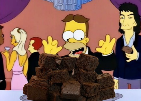 homer simpson at a party looking excited about a plate piled with brownies