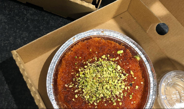 Kanafeh in a takeaway cardboard box from kanafeh kingz food truck