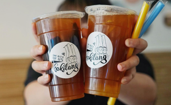 two iced tea cups with the Kakilang logo