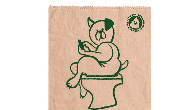 cartoon drawing of a dog sitting on a toilet on a brown paper bag