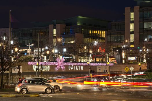 exterior of dundrum town centre at night, decorated with christmas lights