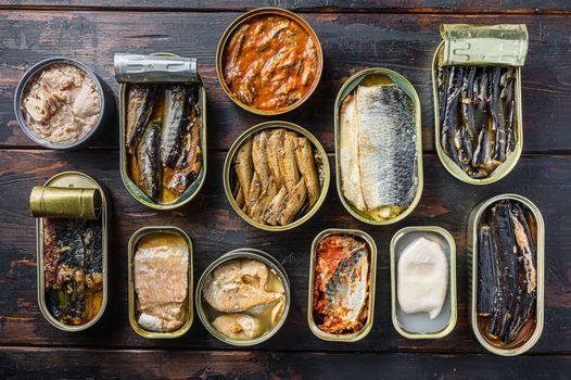 an assortment of tinned fish with lids open