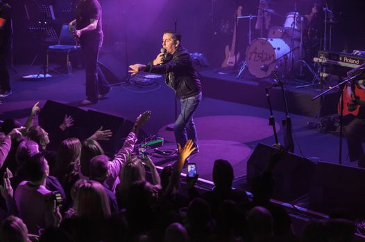 christy dignam on stage at an aslan concert
