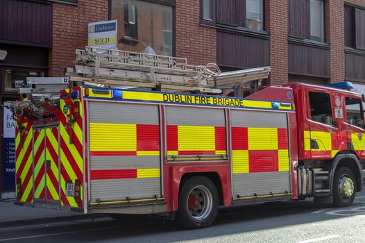a dublin fire brigade parked outside a building