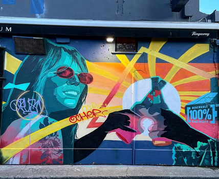 a colourful street art mural on a wall in dublin