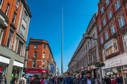 Mary Street in Dublin, full of people. The spire can be seen in the background