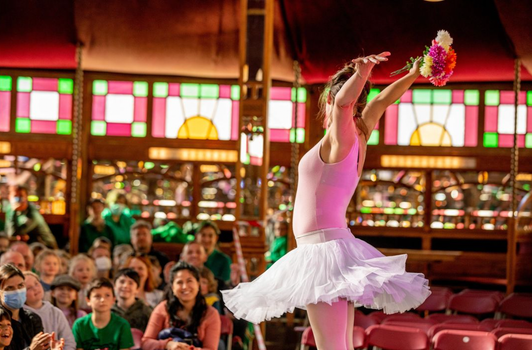 ballerina on stage at a paddys day performance in an irish pub